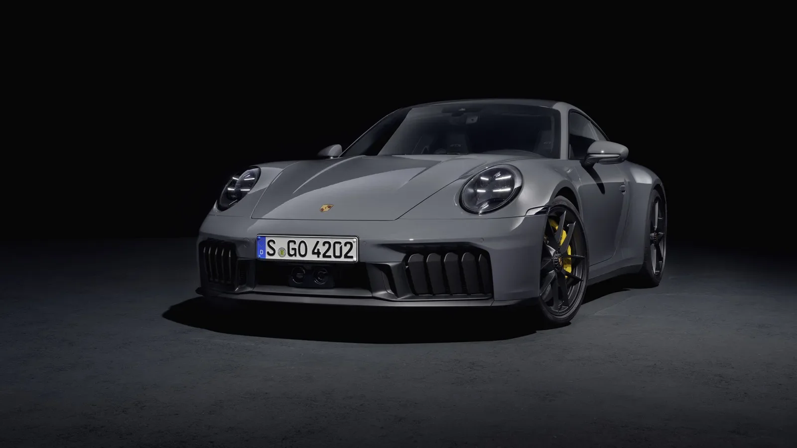 2025 911 Carrera GTS Hybrid back view on the road