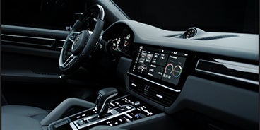 Couple Driving Porsche Cayenne in Palm Springs CA