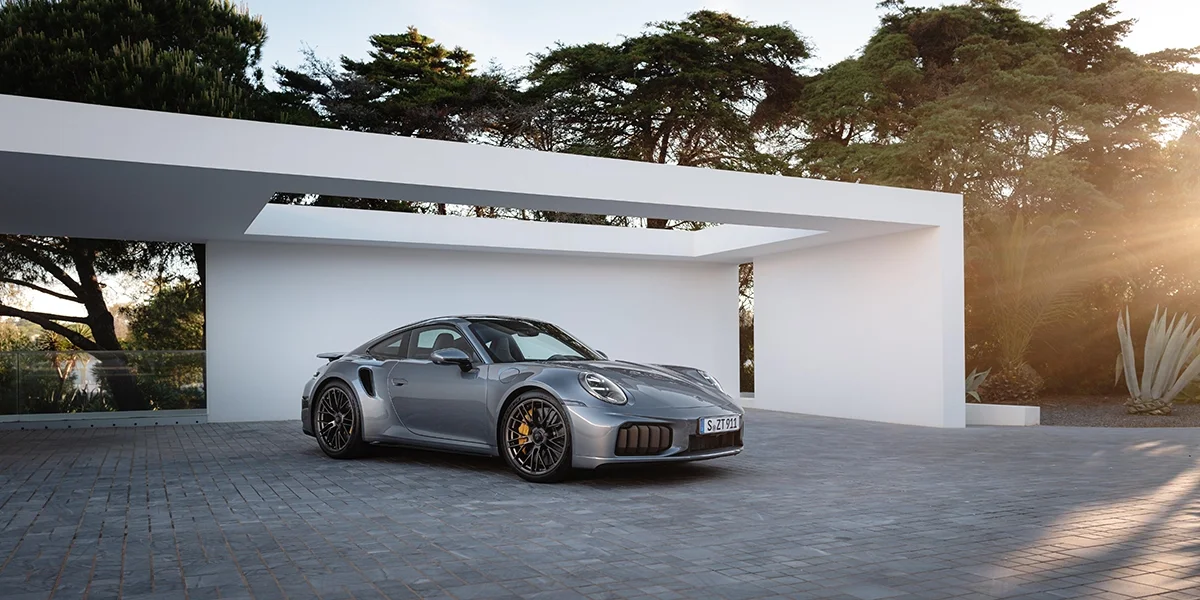 2026 Porsche 911 Turbo S parked in front of modern luxury home for sale in Palm Springs, CA