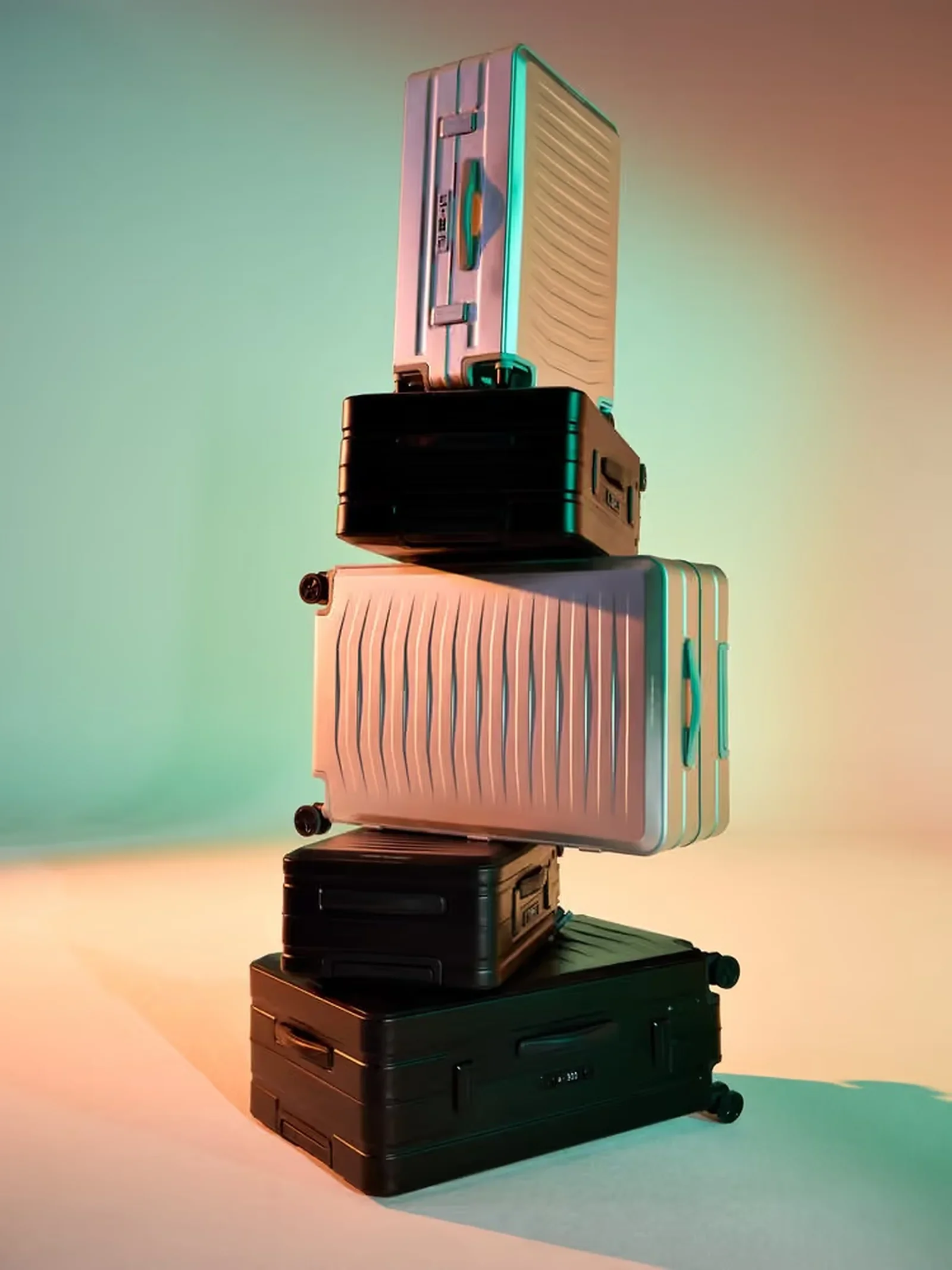 Stacked Porsche travel luggage in a studio setting